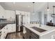 Modern kitchen with stainless steel appliances, an island with seating, and plenty of storage at 14734 Domino Dr, Parker, CO 80134