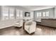 Bright living room with wood floors, plantation shutters and contemporary furniture at 14734 Domino Dr, Parker, CO 80134
