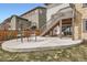 Enjoy outdoor living on this concrete patio with stair access to the deck and yard at 14734 Domino Dr, Parker, CO 80134