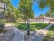 Beautiful common area with manicured landscaping, mature trees, and walking paths for residents to enjoy at 6800 E Tennessee Ave # 533, Denver, CO 80224