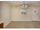 Bright dining area featuring tiled floor, a window view, and modern lighting fixture at 6800 E Tennessee Ave # 533, Denver, CO 80224
