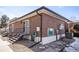 A clean home exterior featuring brickwork, stairs to an entryway, and tidy landscaping at 6800 E Tennessee Ave # 533, Denver, CO 80224