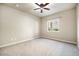 Bedroom with neutral walls, ceiling fan, and lots of natural light from the window at 1144 Rockhurst Dr # 105, Highlands Ranch, CO 80129