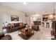 Spacious living room adjacent to a kitchen and dining area at 1144 Rockhurst Dr # 105, Highlands Ranch, CO 80129