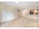 Spacious living room adjacent to a kitchen and dining area at 1144 Rockhurst Dr # 105, Highlands Ranch, CO 80129