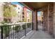Brick patio offers views of the beautifully landscaped condo community at 1144 Rockhurst Dr # 105, Highlands Ranch, CO 80129