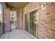 Brick patio with sliding glass doors creates indoor/outdoor living space at 1144 Rockhurst Dr # 105, Highlands Ranch, CO 80129