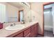 Large bathroom with double vanity, expansive mirror, and updated fixtures provides a spa-like experience at 5483 Gunnison Dr, Frederick, CO 80504