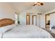 Light-filled bedroom with vaulted ceiling, neutral carpet, and ample closet space offers a tranquil retreat at 5483 Gunnison Dr, Frederick, CO 80504