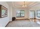Elegant dining room with a tray ceiling, chandelier, a large window, and hardwood floors at 5483 Gunnison Dr, Frederick, CO 80504