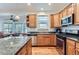Bright kitchen boasts granite countertops, stainless steel appliances, and ample cabinet space, perfect for culinary enthusiasts at 5483 Gunnison Dr, Frederick, CO 80504