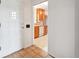 Welcoming entryway with tile flooring leading to the kitchen with wood cabinets at 10150 Melody Dr, Northglenn, CO 80260
