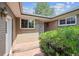 Inviting front entrance with brick facade and well-maintained landscaping at 10150 Melody Dr, Northglenn, CO 80260