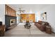 Comfortable living room with a fireplace, wood accent wall, and stylish decor at 10150 Melody Dr, Northglenn, CO 80260