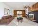 Bright living room featuring a fireplace, built-in shelves, and a modern design at 10150 Melody Dr, Northglenn, CO 80260