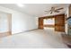 Large living room with a fireplace, built-in shelves, and a view of the entryway at 10150 Melody Dr, Northglenn, CO 80260