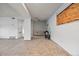View of unfinished basement area with concrete floors, showing ample space for future customization or storage at 1723 Robb St # 43, Lakewood, CO 80215
