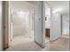 Hallway access to the bathroom, showcasing potential for renovation at 1723 Robb St # 43, Lakewood, CO 80215