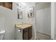 Bathroom with vanity and tile, showcasing its current features and potential for future renovation and style upgrades at 1723 Robb St # 43, Lakewood, CO 80215
