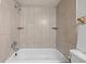 Close-up of a bathroom shower with tile surround, showcasing the functional layout, ready for renovation and design ideas at 1723 Robb St # 43, Lakewood, CO 80215