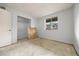 Awaiting your personal touch, this bedroom offers unfinished floors and a blank canvas for your style at 1723 Robb St # 43, Lakewood, CO 80215