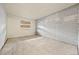 Spacious bedroom with a painted brick wall and natural light at 1723 Robb St # 43, Lakewood, CO 80215