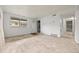 Bright living room featuring plywood, closet, and ample natural light at 1723 Robb St # 43, Lakewood, CO 80215