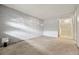 Versatile room with a painted brick wall, ready for personalization at 1723 Robb St # 43, Lakewood, CO 80215