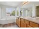 Bathroom featuring double sinks, bathtub, and bright light at 19157 E Progress Ave, Centennial, CO 80015