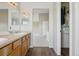 Bathroom view leading to closet and bedroom, features double sinks at 19157 E Progress Ave, Centennial, CO 80015