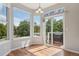 Bright breakfast nook area featuring large windows, sliding glass doors, and access to outdoor deck at 19157 E Progress Ave, Centennial, CO 80015