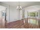 Elegant dining area featuring hardwood floors, a chandelier, and an open layout, ideal for gatherings at 19157 E Progress Ave, Centennial, CO 80015