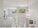Bright entryway showcasing an elegant light fixture and a staircase leading to the upper level at 19157 E Progress Ave, Centennial, CO 80015