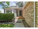 Inviting front porch with stone accents and a well-manicured lawn, providing a welcoming entrance at 19157 E Progress Ave, Centennial, CO 80015