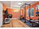 Home gym featuring weight rack, desk, and natural light at 19157 E Progress Ave, Centennial, CO 80015