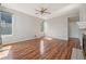Empty Living Room featuring natural light, hard wood floors and a white painted door at 19157 E Progress Ave, Centennial, CO 80015