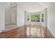 Bright and spacious living room with hardwood floors and large windows, offering a comfortable living space at 19157 E Progress Ave, Centennial, CO 80015