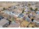 This aerial view captures the neighborhood layout featuring tree-lined streets and well-maintained homes at 9377 Weeping Willow Ct, Highlands Ranch, CO 80130