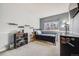 Well-lit bedroom with a single bed, desk, and shelving, perfect for a or teenager at 9377 Weeping Willow Ct, Highlands Ranch, CO 80130