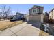 Charming two-story home features a well-maintained lawn, complemented by an attached two-car garage at 9377 Weeping Willow Ct, Highlands Ranch, CO 80130