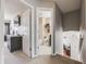 Hallway leading to the bathroom, bedroom, and office, providing a glimpse into the home's layout at 9377 Weeping Willow Ct, Highlands Ranch, CO 80130