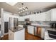 Spacious kitchen featuring stainless steel appliances, a granite countertop, and ample storage at 9377 Weeping Willow Ct, Highlands Ranch, CO 80130