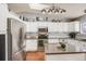 Kitchen showcasing stainless steel appliances, granite countertops and ample cabinet space at 9377 Weeping Willow Ct, Highlands Ranch, CO 80130