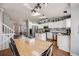 Bright kitchen featuring stainless steel appliances, white cabinetry, and central island at 9377 Weeping Willow Ct, Highlands Ranch, CO 80130