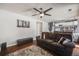 Comfortable living room with a plush sofa, ottoman, and stylish rug, perfect for relaxation and entertainment at 9377 Weeping Willow Ct, Highlands Ranch, CO 80130