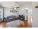 Open-concept living room with hardwood floors, neutral tones, and seamless flow to other areas at 9377 Weeping Willow Ct, Highlands Ranch, CO 80130