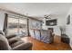 Inviting living room featuring a cozy gray sofa, fireplace, and sliding glass doors to the outdoor space at 9377 Weeping Willow Ct, Highlands Ranch, CO 80130