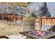 Spacious outdoor patio with a built-in grill and cozy fire pit area at 9377 Weeping Willow Ct, Highlands Ranch, CO 80130