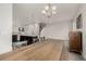 Dining area featuring a long wooden table with an island kitchen in the background at 619 Brennan Cir, Erie, CO 80516