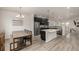 Kitchen with a dining table, a large island, and stainless steel appliances at 619 Brennan Cir, Erie, CO 80516